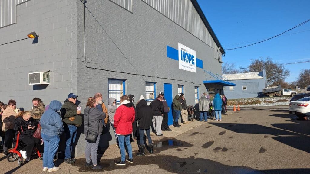 Photo of people waiting to get food at the Wooster Hope Center's Greater Wayne County Pantry